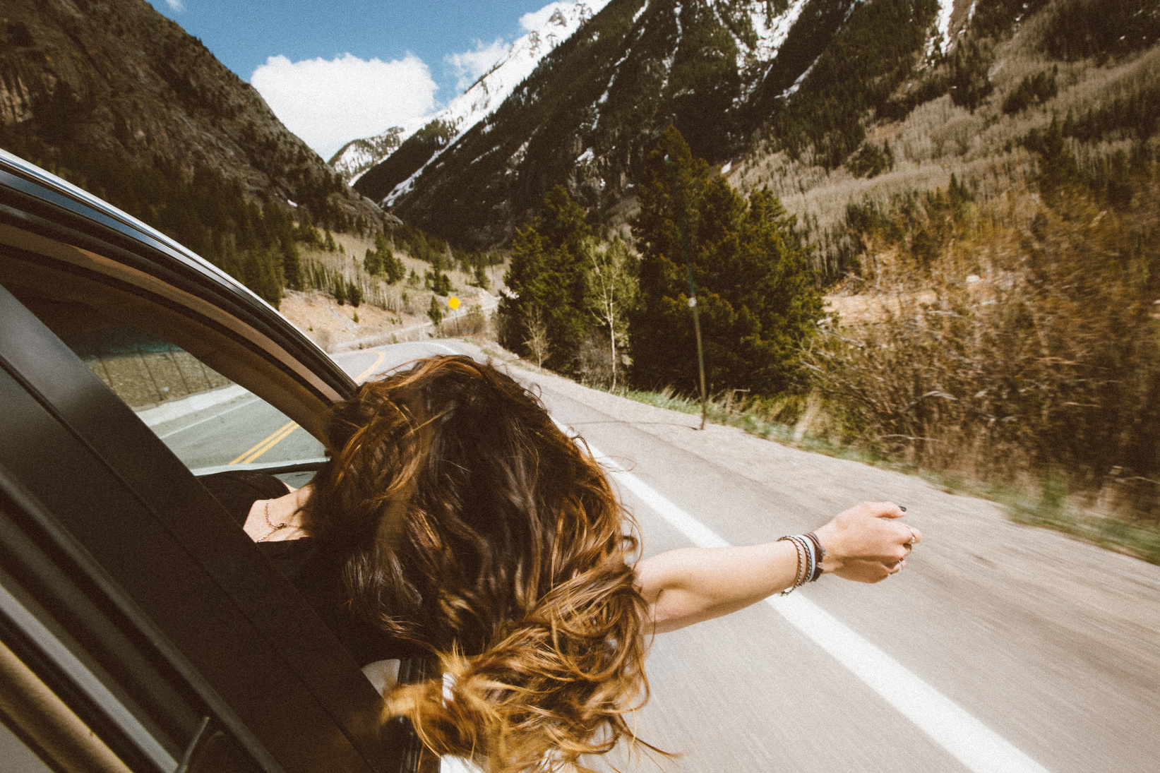 Woman Enjoying Road Travel